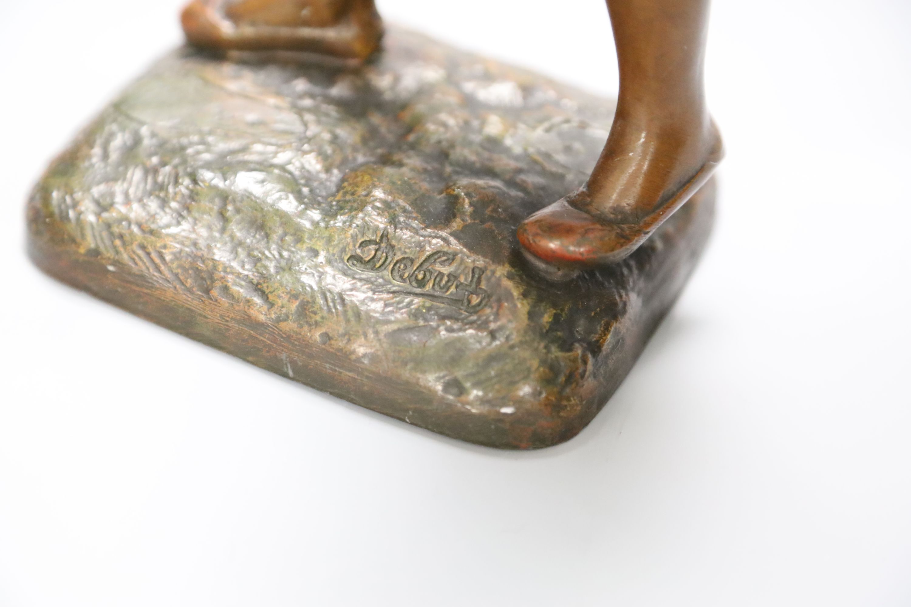 A spelter figure of a watercarrier, signed Debut, height 31cm